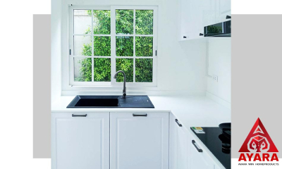 ชุดครัว Built-in โครงซีเมนต์บอร์ด หน้าบาน PVC สีขาวเงา ลายเซาะ CNC